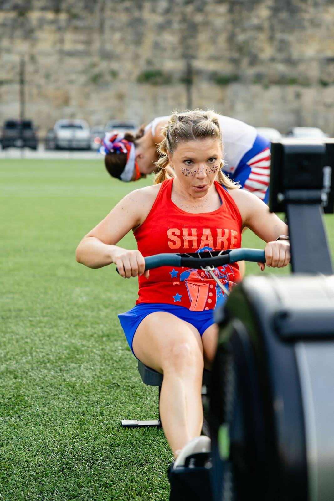 An athlete rowing with full intensity