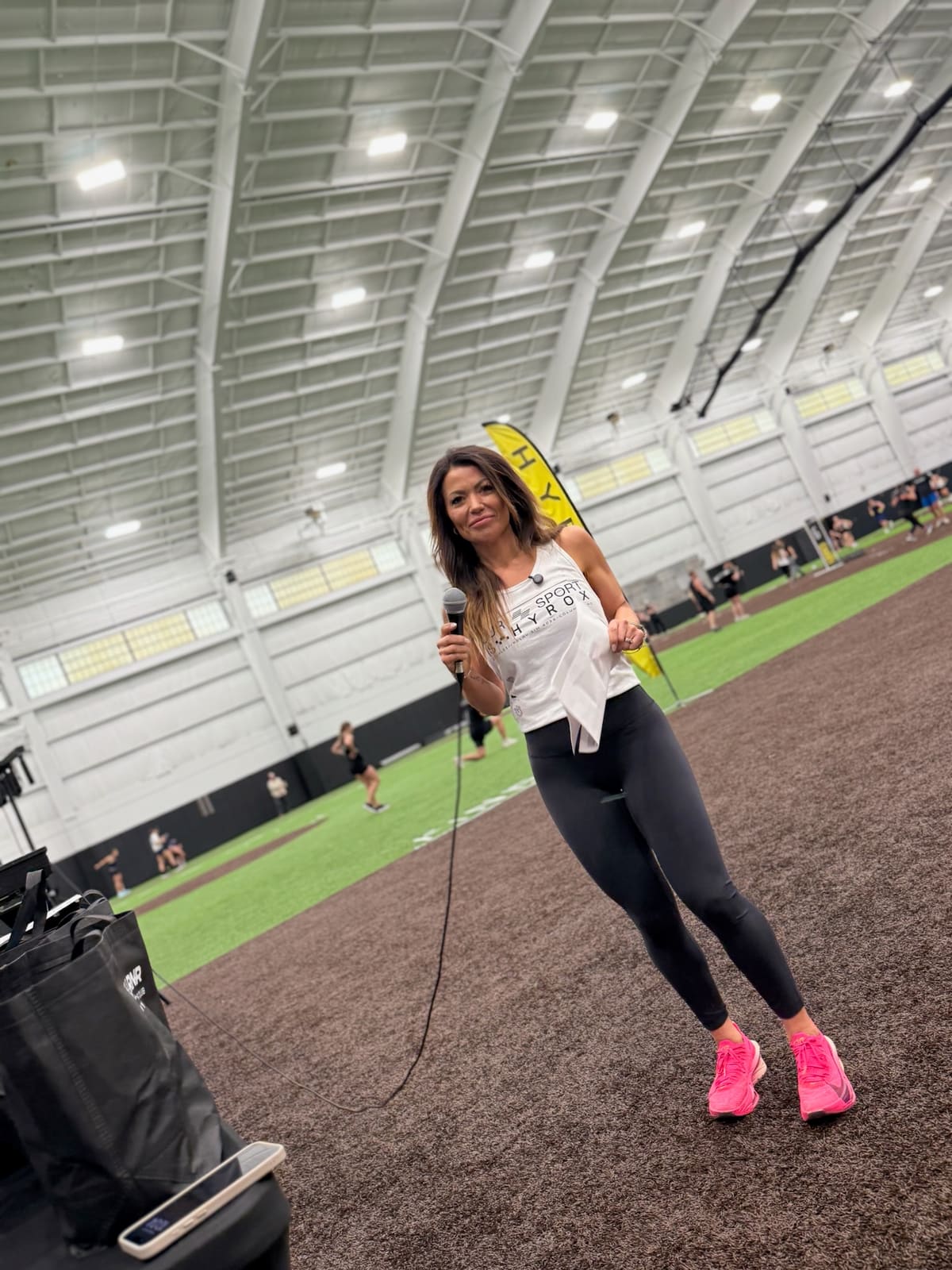 Karen speaking on the mic indoors