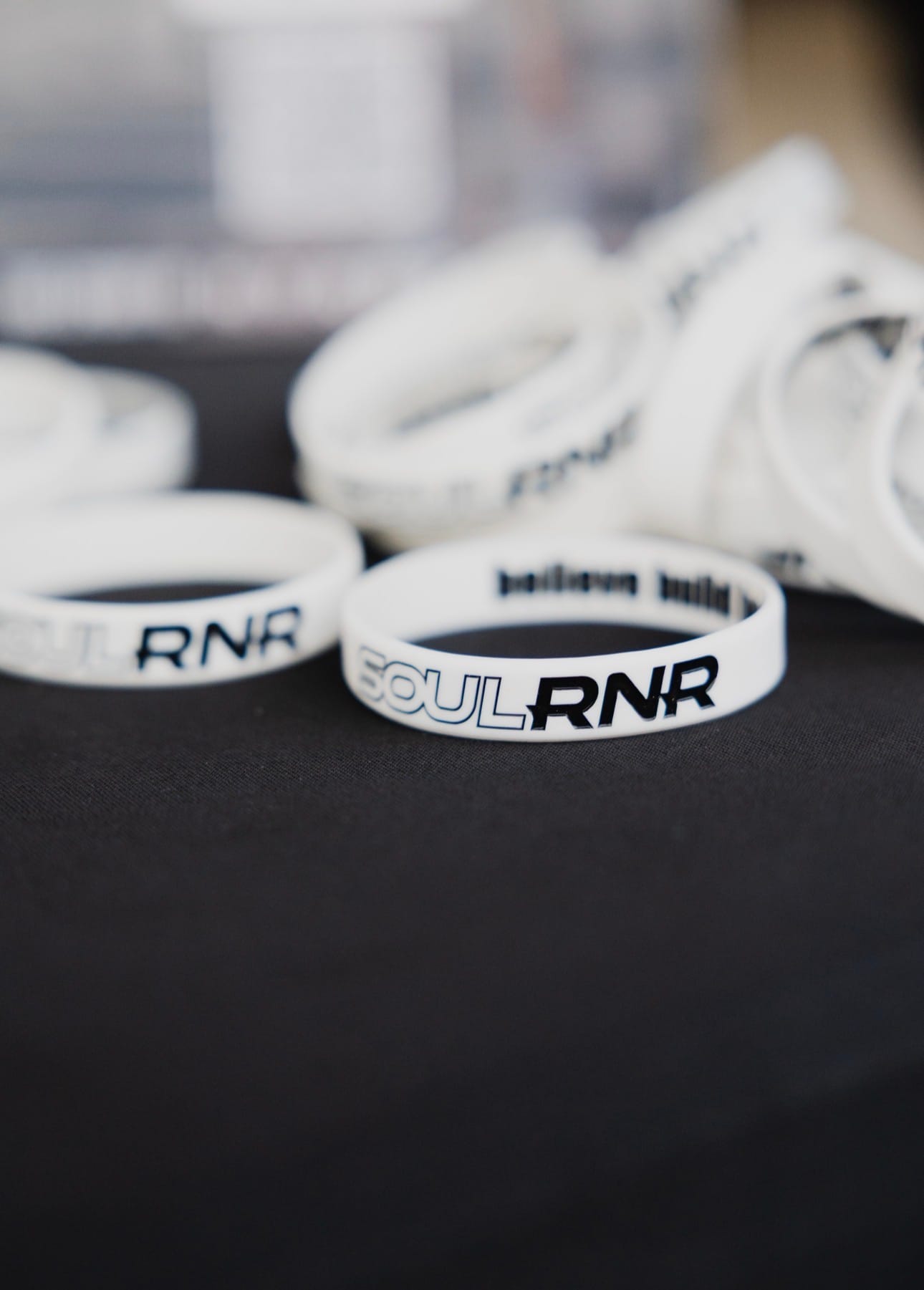 SOULRNR wristbands — believe, build, become printed on the inside of every band